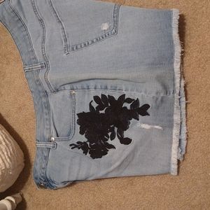 Lane Bryant Denim shorts with black rose applique.
